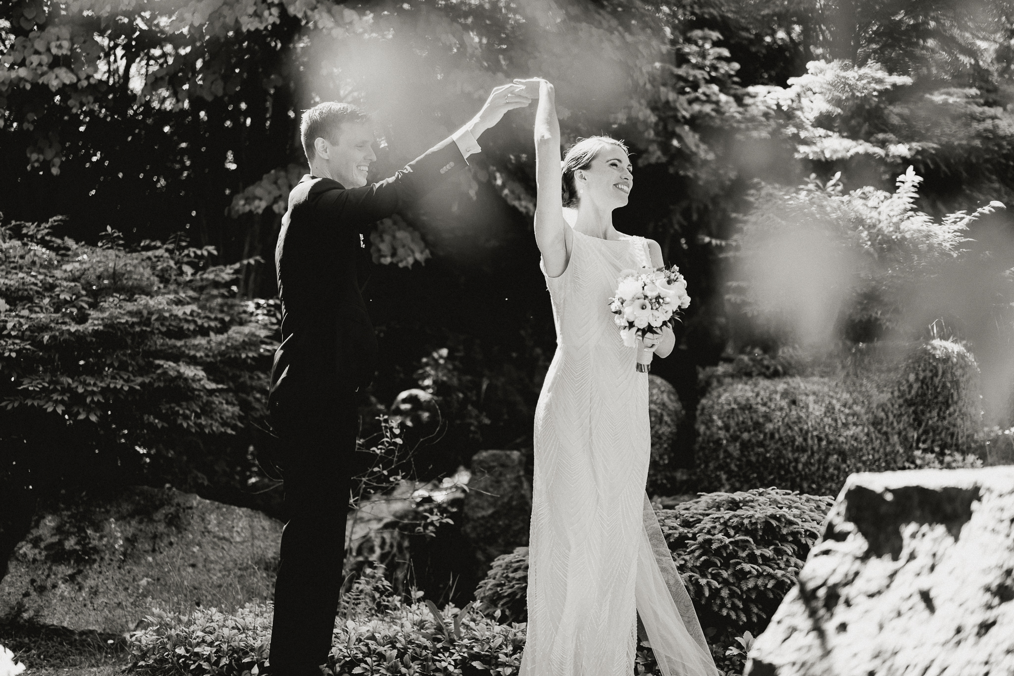 A wedding couple dancing together in nature