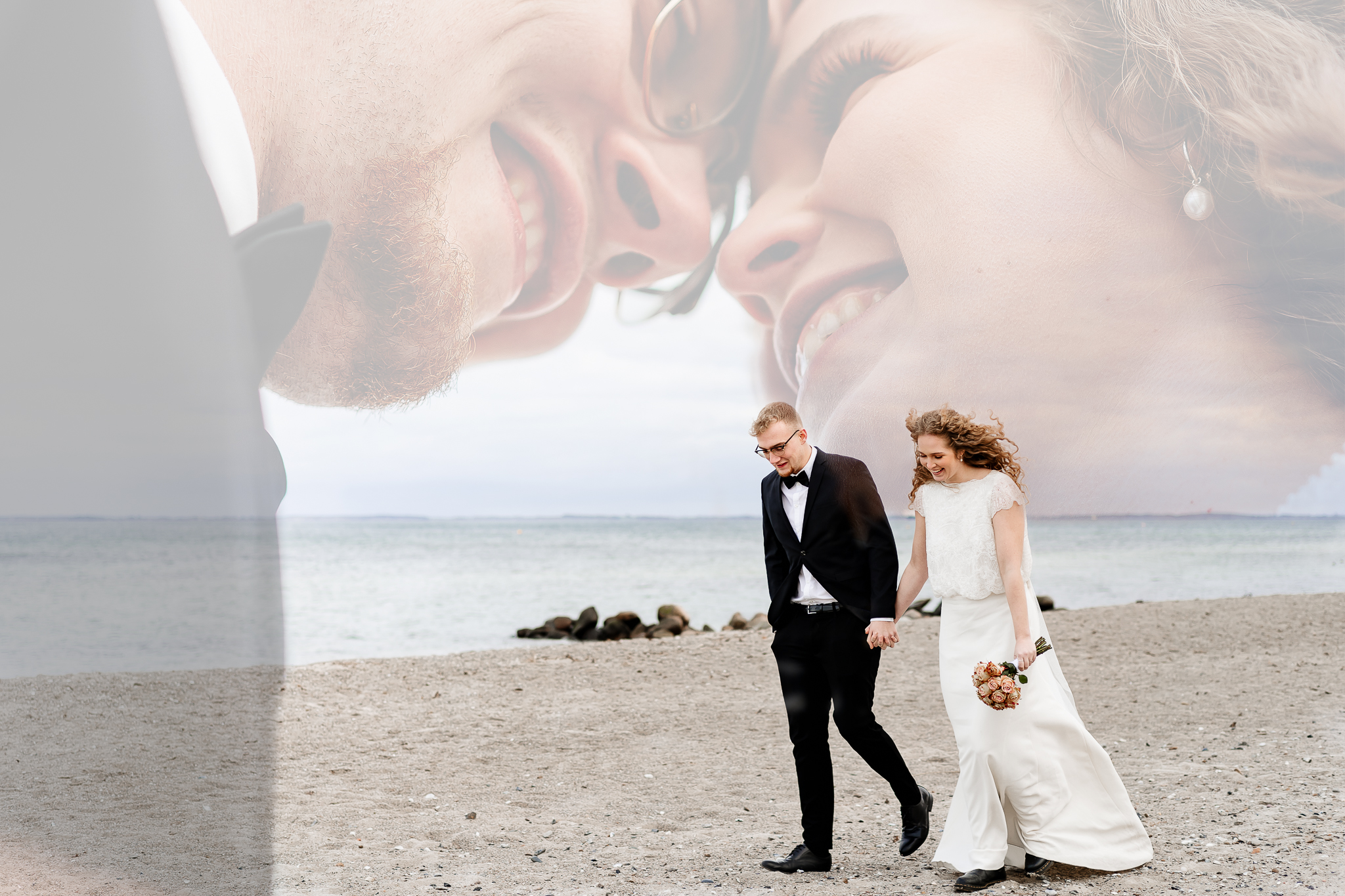 A wedding couple walking on the beach