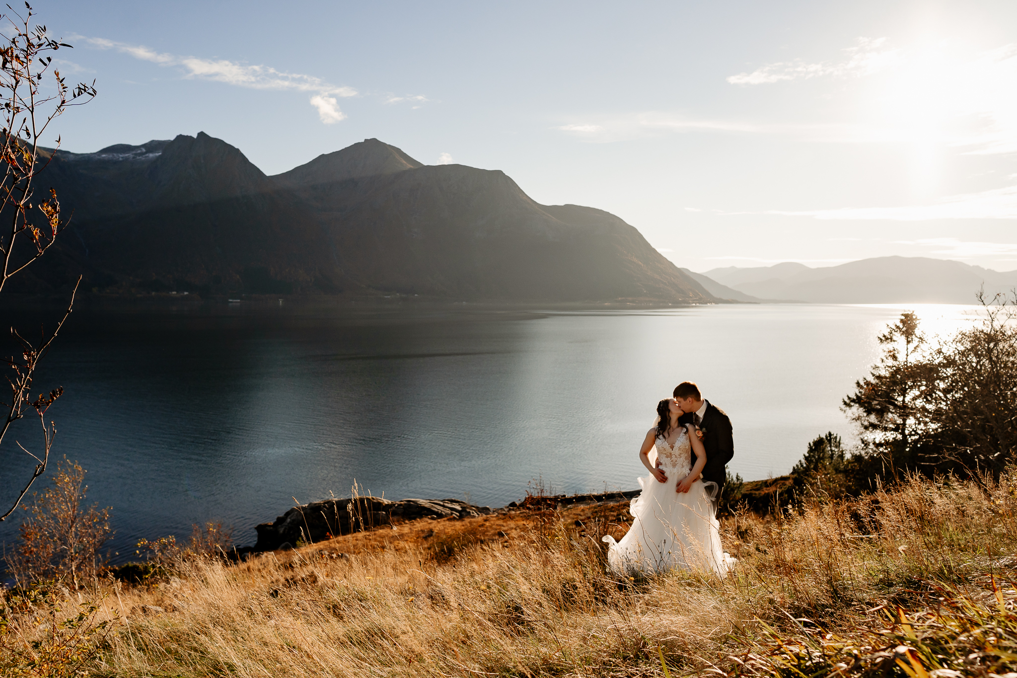 Bride and groom in nature with mountains in the background