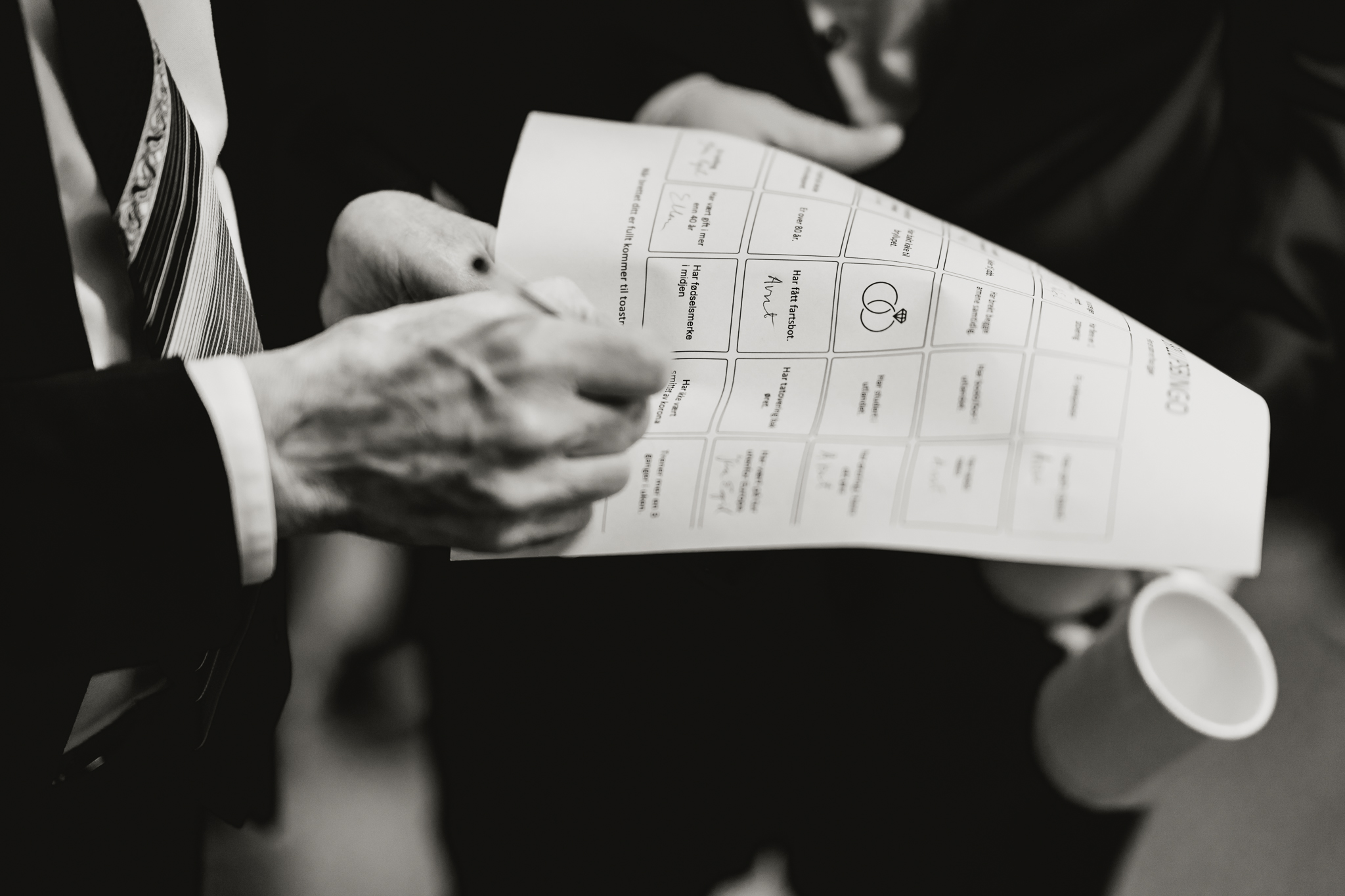 A man writing on a piece of paper